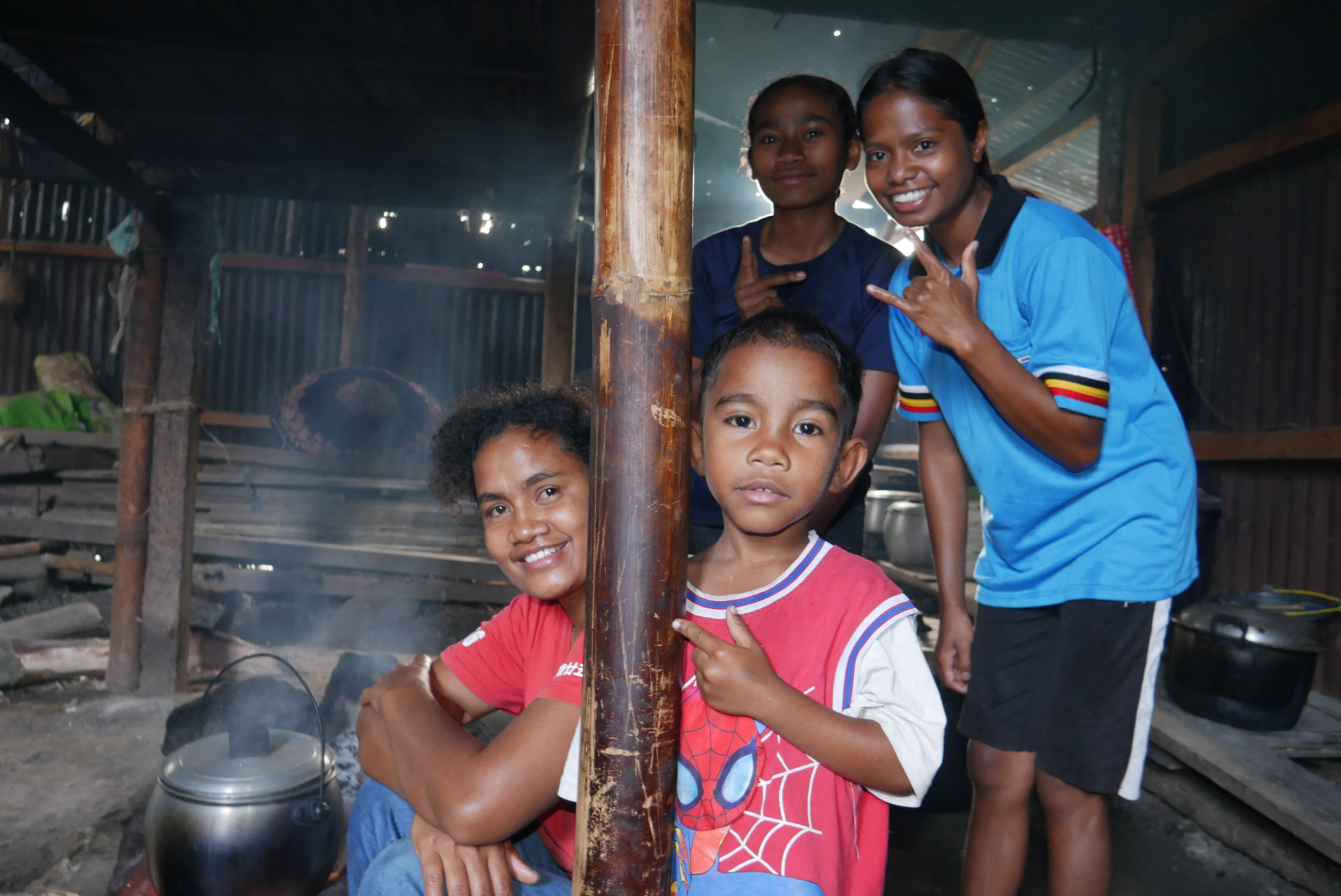 Host mom with sisters and child in kitchen